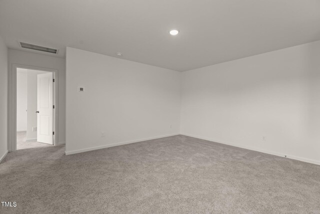 825 Kenyon Spring Dr, Zebulon, NC 27597 - carpeted spare room featuring recessed lighting, visible vents, and baseboards