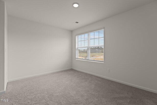 825 Kenyon Spring Dr, Zebulon, NC 27597 - empty room featuring carpet floors, baseboards, and visible vents