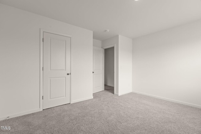 825 Kenyon Spring Dr, Zebulon, NC 27597 - unfurnished bedroom featuring carpet floors and baseboards