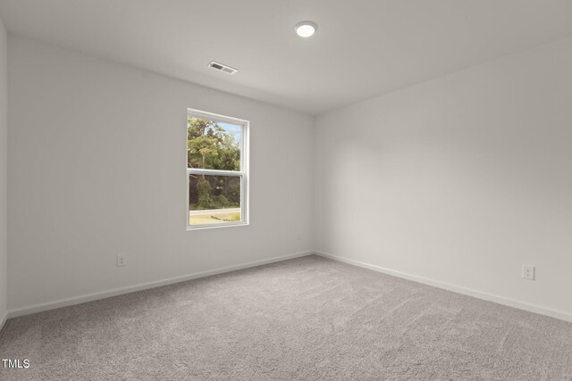 825 Kenyon Spring Dr, Zebulon, NC 27597 - carpeted spare room featuring baseboards and visible vents