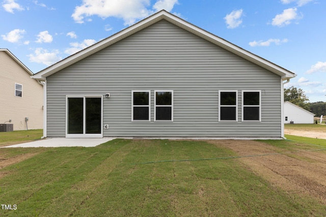 825 Kenyon Spring Dr, Zebulon, NC 27597 - rear view of house featuring a yard, a patio, and central air condition unit