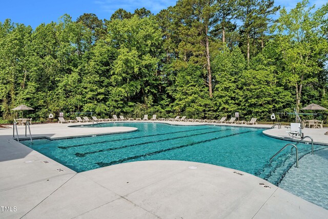 825 Kenyon Spring Dr, Zebulon, NC 27597 - pool featuring a patio