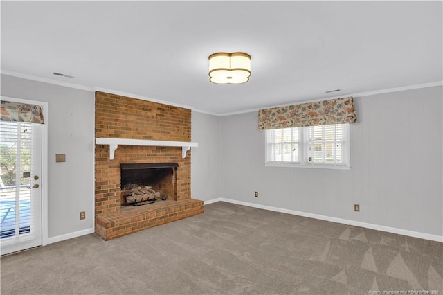 unfurnished living room with baseboards, visible vents, carpet floors, and ornamental molding