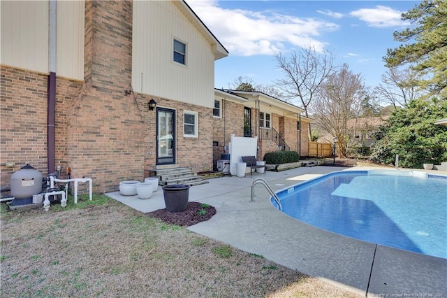 outdoor pool with a patio