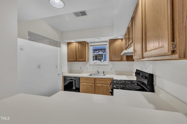 1442 Barton Place Dr, Raleigh, NC 27608 - kitchen featuring visible vents, black appliances, under cabinet range hood, light countertops, and a sink