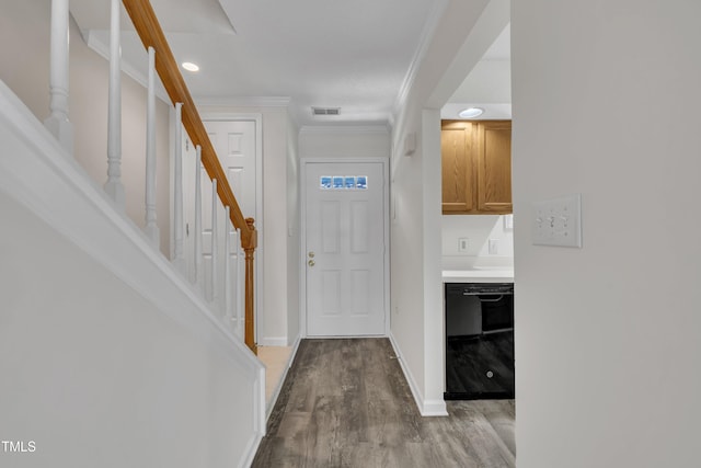 1442 Barton Place Dr, Raleigh, NC 27608 - foyer with ornamental molding, visible vents, wood finished floors, stairs, and baseboards