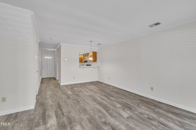 1442 Barton Place Dr, Raleigh, NC 27608 - interior space featuring crown molding, wood finished floors, baseboards, and visible vents