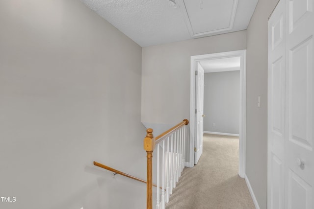 1442 Barton Place Dr, Raleigh, NC 27608 - hall featuring light carpet, an upstairs landing, and baseboards