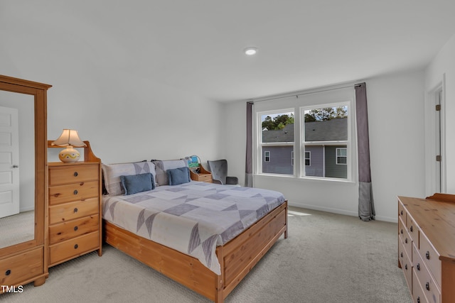 bedroom with light carpet, baseboards, and recessed lighting