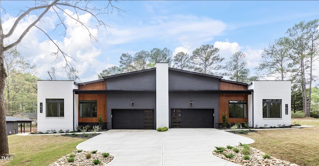 1621 Bruce Cir, Raleigh, NC 27604 - contemporary house with an attached garage, concrete driveway, and a front yard