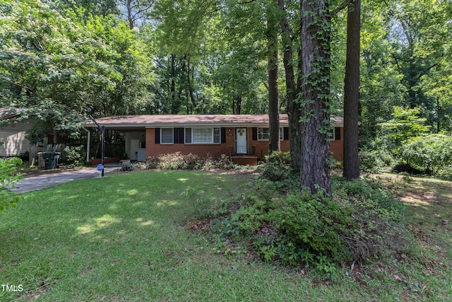 1500 Lakeside Dr, Garner, NC 27529 - ranch-style home with driveway, a front lawn, a carport, and brick siding