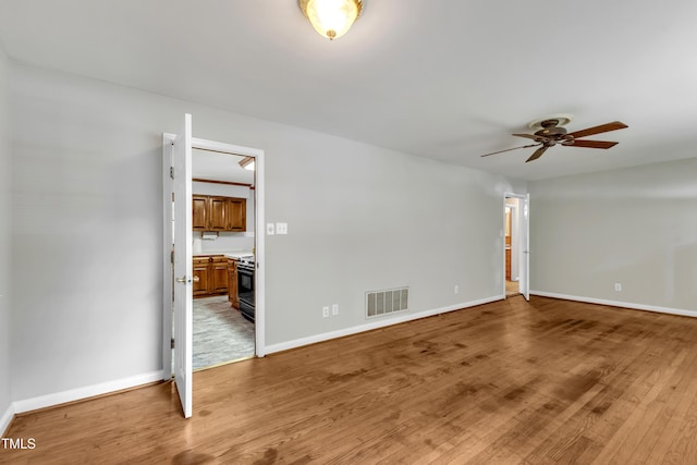 1500 Lakeside Dr, Garner, NC 27529 - spare room featuring light wood-style flooring and ceiling fan