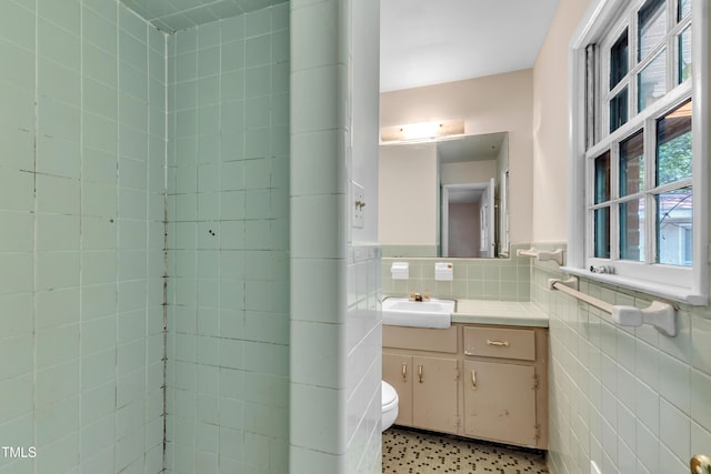 1500 Lakeside Dr, Garner, NC 27529 - bathroom featuring tile walls, vanity, and wainscoting