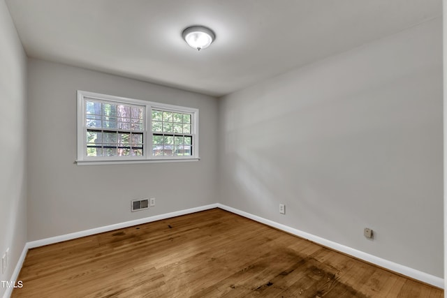 1500 Lakeside Dr, Garner, NC 27529 - unfurnished room featuring wood finished floors and baseboards