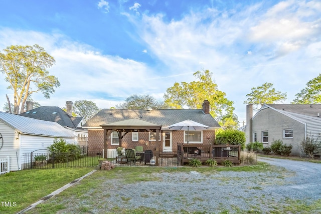 418 S 2nd St, Smithfield, NC 27577 - back of property with fence, a gazebo, brick siding, a wooden deck, and a yard
