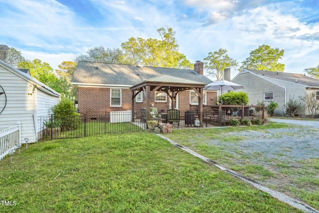 418 S 2nd St, Smithfield, NC 27577 - back of property featuring a chimney, brick siding, a gazebo, fence, and a yard