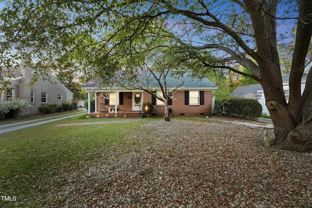 418 S 2nd St, Smithfield, NC 27577 - view of front of home with brick siding, a front yard, covered porch, and crawl space
