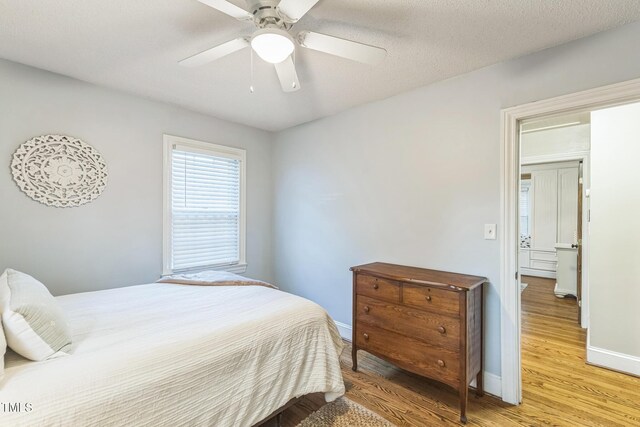 418 S 2nd St, Smithfield, NC 27577 - bedroom featuring baseboards, ceiling fan, and light wood finished floors