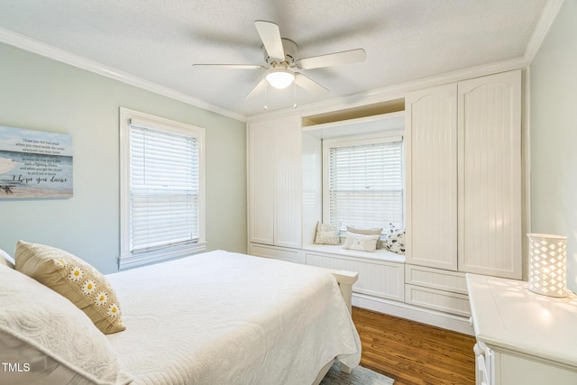 418 S 2nd St, Smithfield, NC 27577 - bedroom featuring a textured ceiling, ceiling fan, dark wood finished floors, and ornamental molding