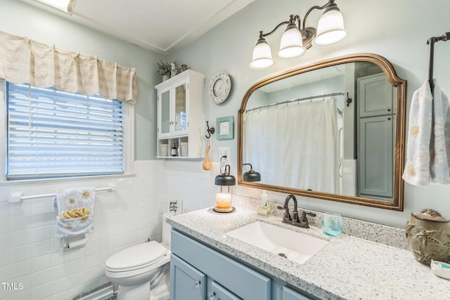 418 S 2nd St, Smithfield, NC 27577 - full bath featuring vanity, curtained shower, toilet, tile walls, and a wainscoted wall