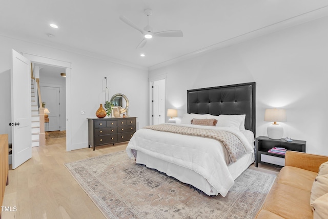 bedroom with baseboards, ornamental molding, ceiling fan, recessed lighting, and light wood-type flooring