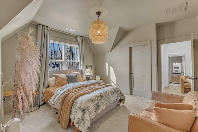 carpeted bedroom with vaulted ceiling and visible vents