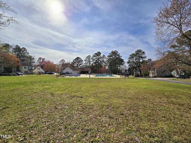 view of yard with an outdoor pool