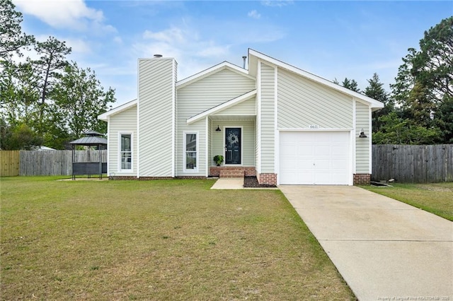6611 Brannan Way, Fayetteville, NC 28314 - mid-century home with driveway, a garage, and a chimney