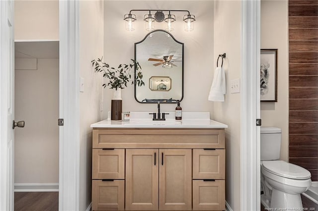 6611 Brannan Way, Fayetteville, NC 28314 - bathroom with vanity, a ceiling fan, toilet, and baseboards