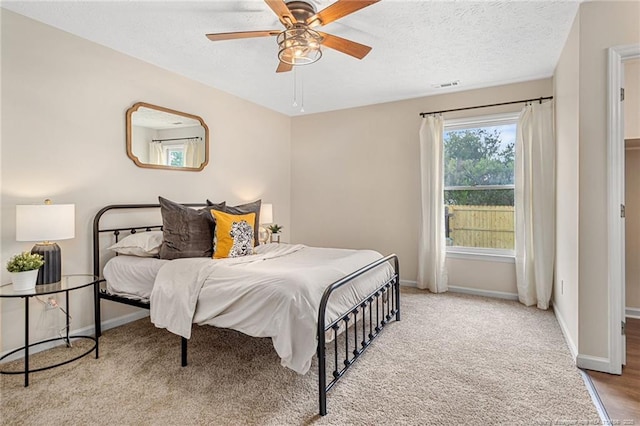 6611 Brannan Way, Fayetteville, NC 28314 - carpeted bedroom featuring baseboards, a ceiling fan, and a textured ceiling