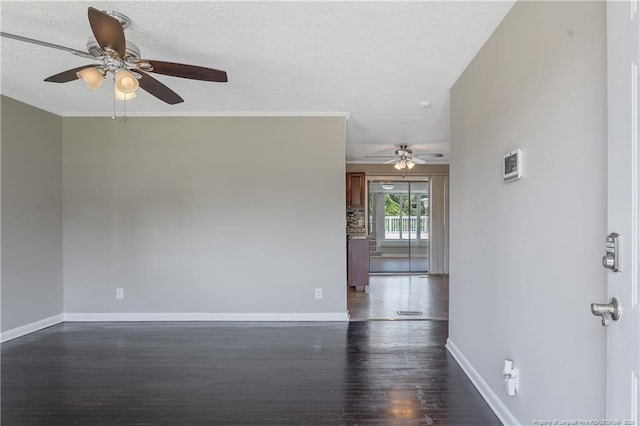 6026 Cornish St, Fayetteville, NC 28314 - unfurnished room with a ceiling fan, dark wood-style floors, and baseboards