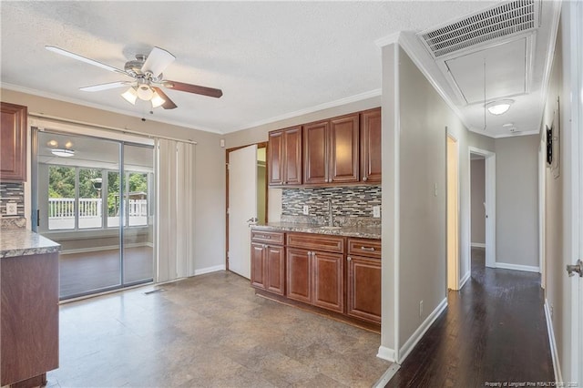 6026 Cornish St, Fayetteville, NC 28314 - kitchen with backsplash, ceiling fan, crown molding, baseboards, and a sink