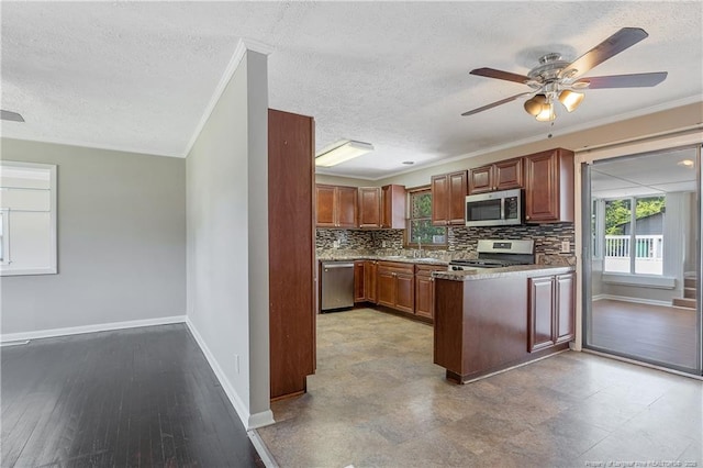 6026 Cornish St, Fayetteville, NC 28314 - kitchen featuring stainless steel appliances, baseboards, a textured ceiling, tasteful backsplash, and a ceiling fan
