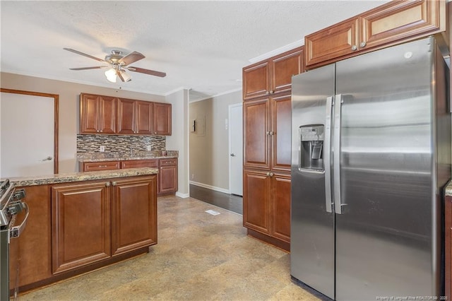 6026 Cornish St, Fayetteville, NC 28314 - kitchen with appliances with stainless steel finishes, a ceiling fan, backsplash, brown cabinetry, and ornamental molding