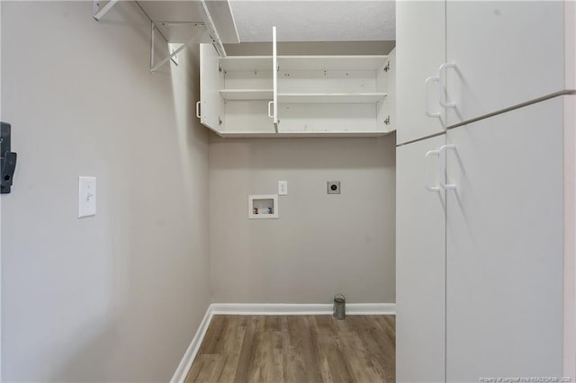 6026 Cornish St, Fayetteville, NC 28314 - laundry area featuring wood finished floors, electric dryer hookup, baseboards, and washer hookup