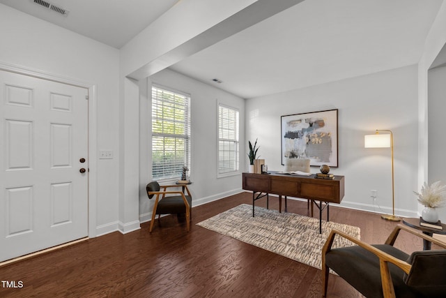 home office featuring wood finished floors and baseboards