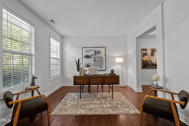 home office featuring wood finished floors and baseboards