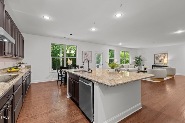 kitchen featuring a sink, healthy amount of natural light, recessed lighting, dishwasher, and dark brown cabinetry