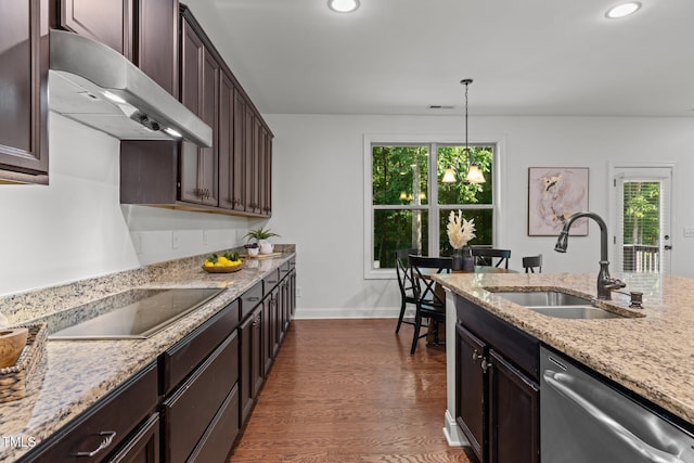 kitchen with stainless steel dishwasher, a sink, under cabinet range hood, black electric stovetop, and plenty of natural light