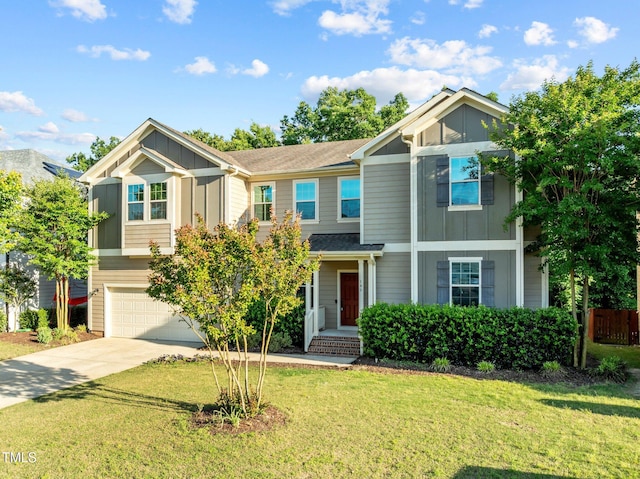 view of front of property with board and batten siding, driveway, an attached garage, and a front yard