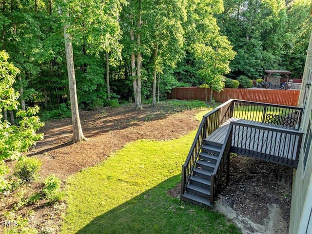 view of yard featuring stairs and a deck