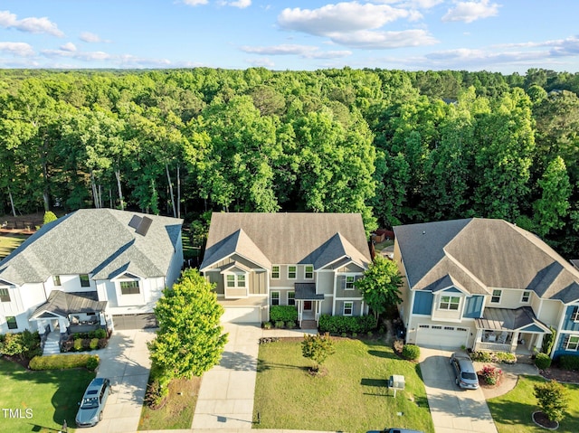 aerial view of residential area with a forest