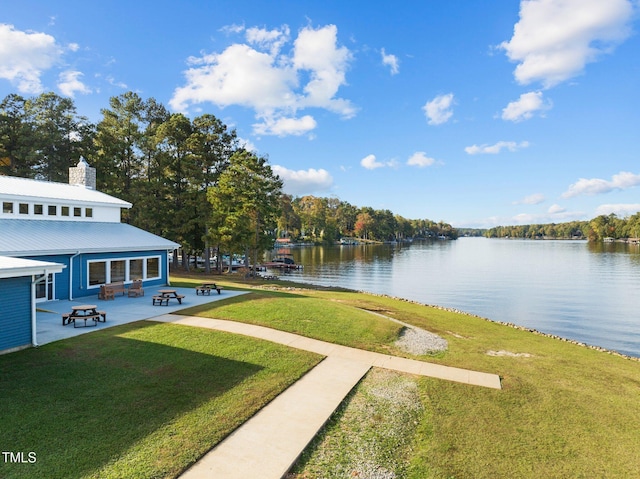 view of yard featuring a patio and a water view
