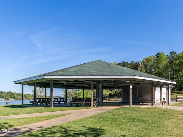 view of home's community with a yard, a gazebo, and a water view
