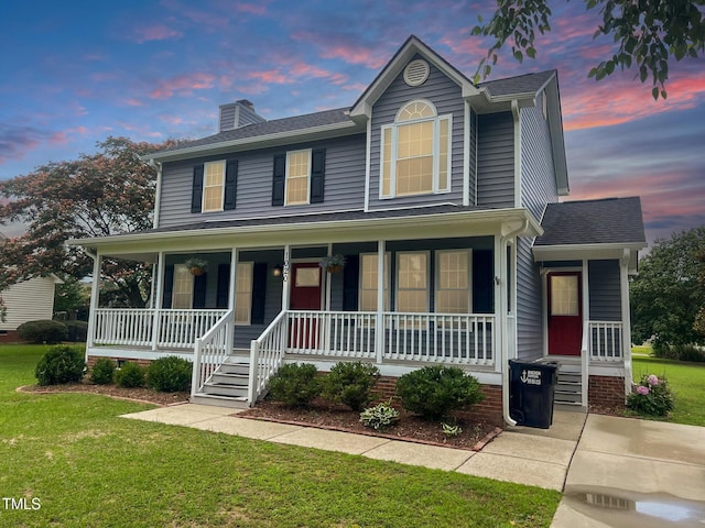 1020 Retriever Ln, Raleigh, NC 27603 - view of front of house featuring covered porch, a chimney, and a yard