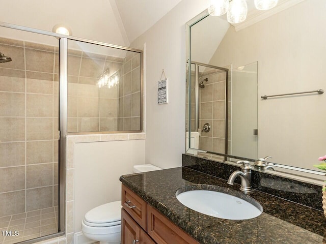 full bath featuring toilet, a stall shower, vanity, and vaulted ceiling