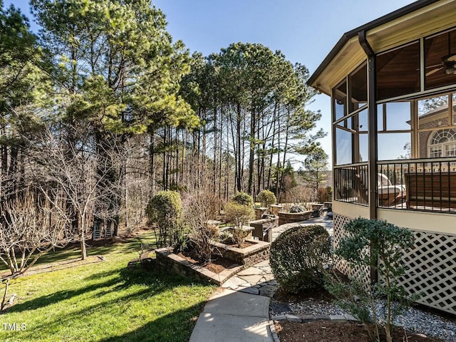 view of yard with a sunroom