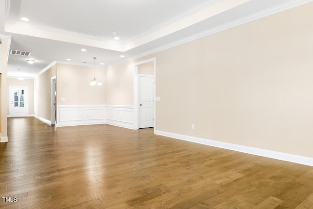 1075 Fairhaven Dr Lot 51, Mebane, NC 27302 - empty room featuring wood finished floors, a raised ceiling, recessed lighting, a chandelier, and ornamental molding