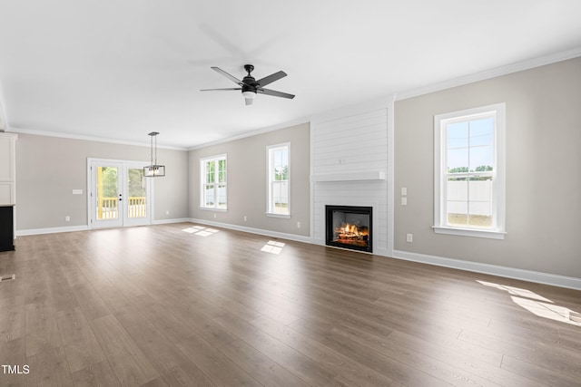 4924 Zebulon Rd, Zebulon, NC 27597 - unfurnished living room featuring a fireplace, crown molding, a ceiling fan, and wood finished floors