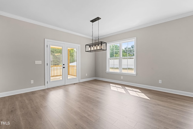 4924 Zebulon Rd, Zebulon, NC 27597 - empty room with a chandelier, french doors, ornamental molding, and dark wood finished floors